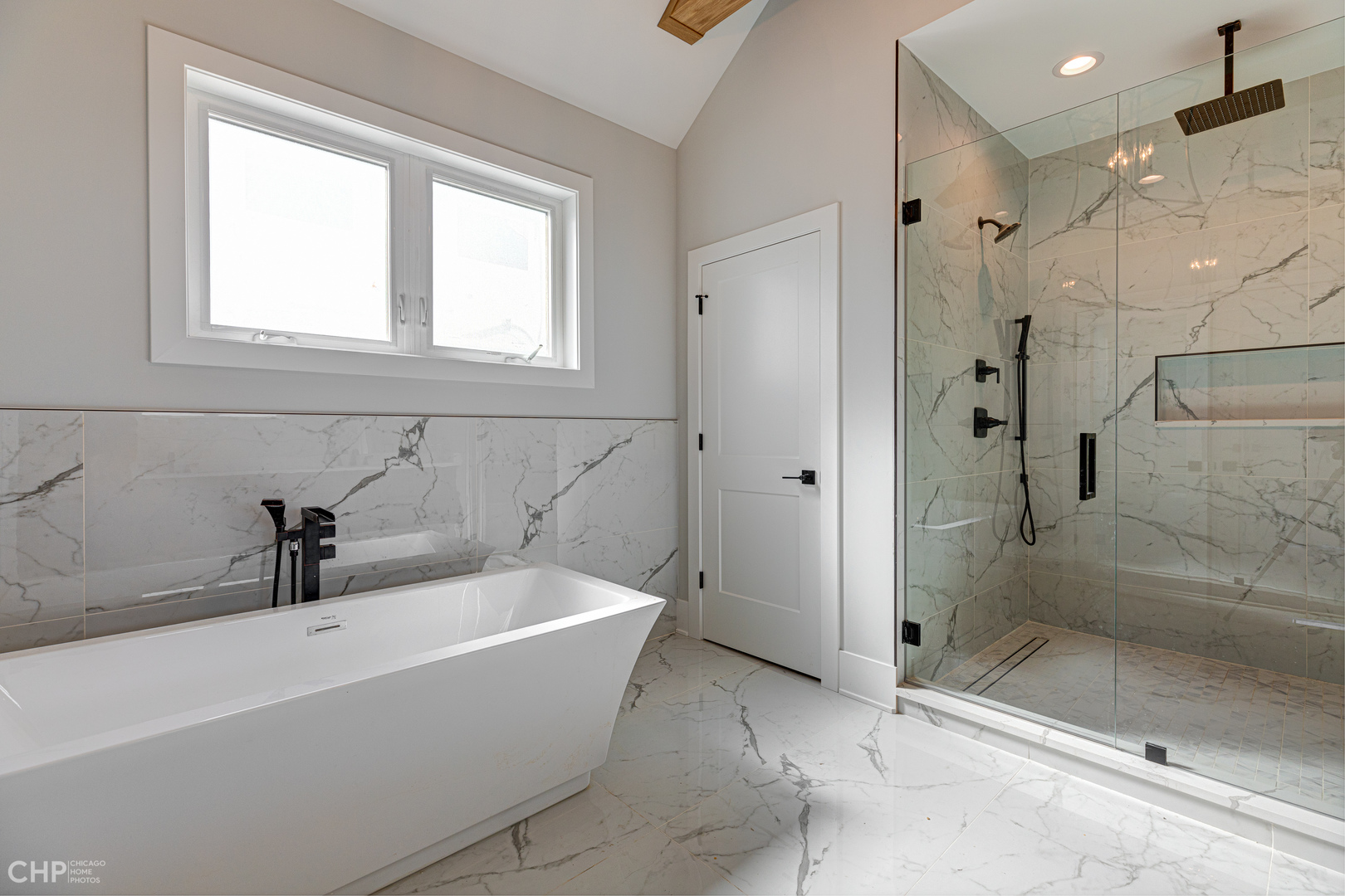 3711 North Spaulding Avenue Chicago, IL 60618 - Photo 20 of 35 a bathroom with a bathtub and shower