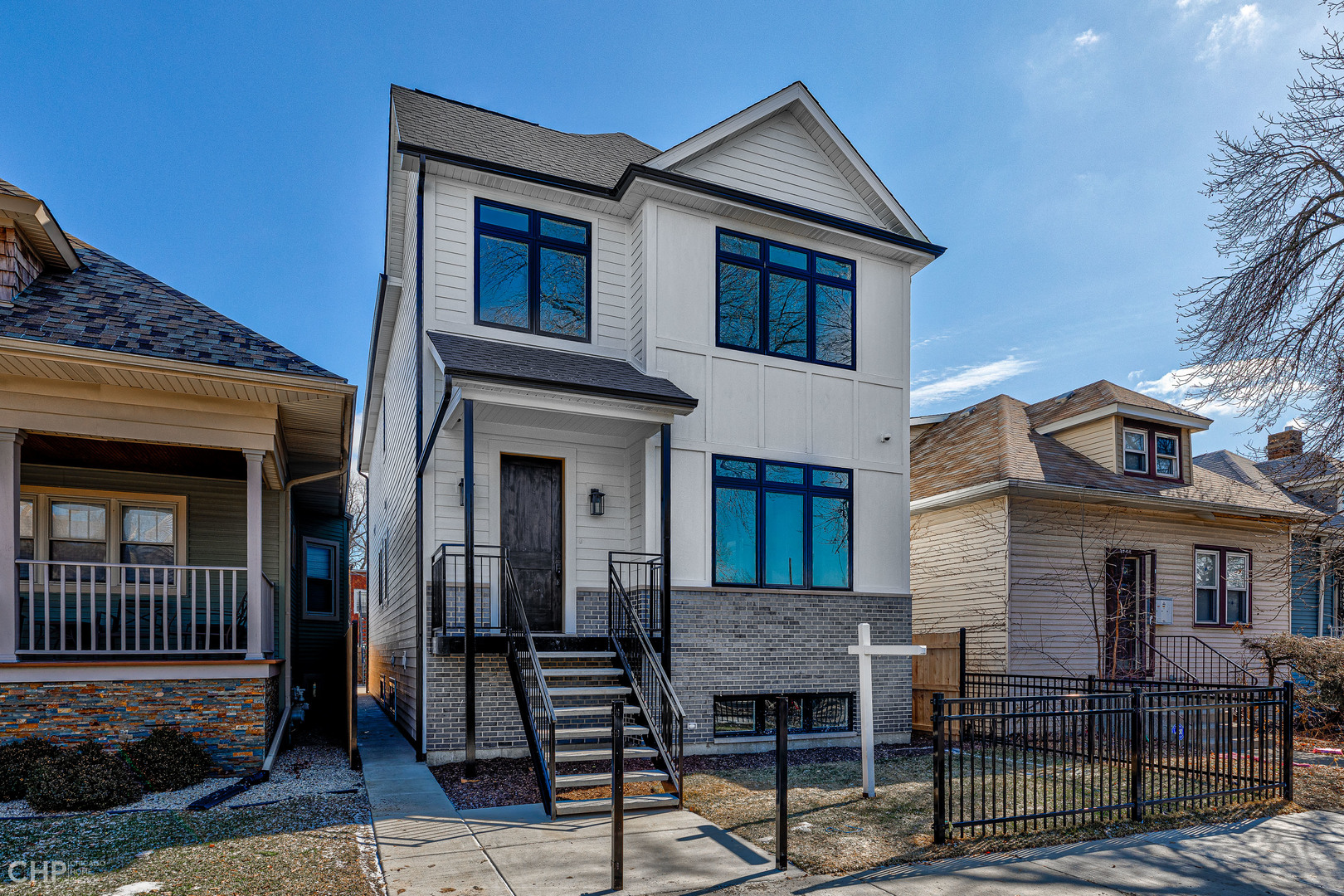 3711 North Spaulding Avenue Chicago, IL 60618 - Photo 2 of 35 a front view of a house with barbeque grill and wooden floor