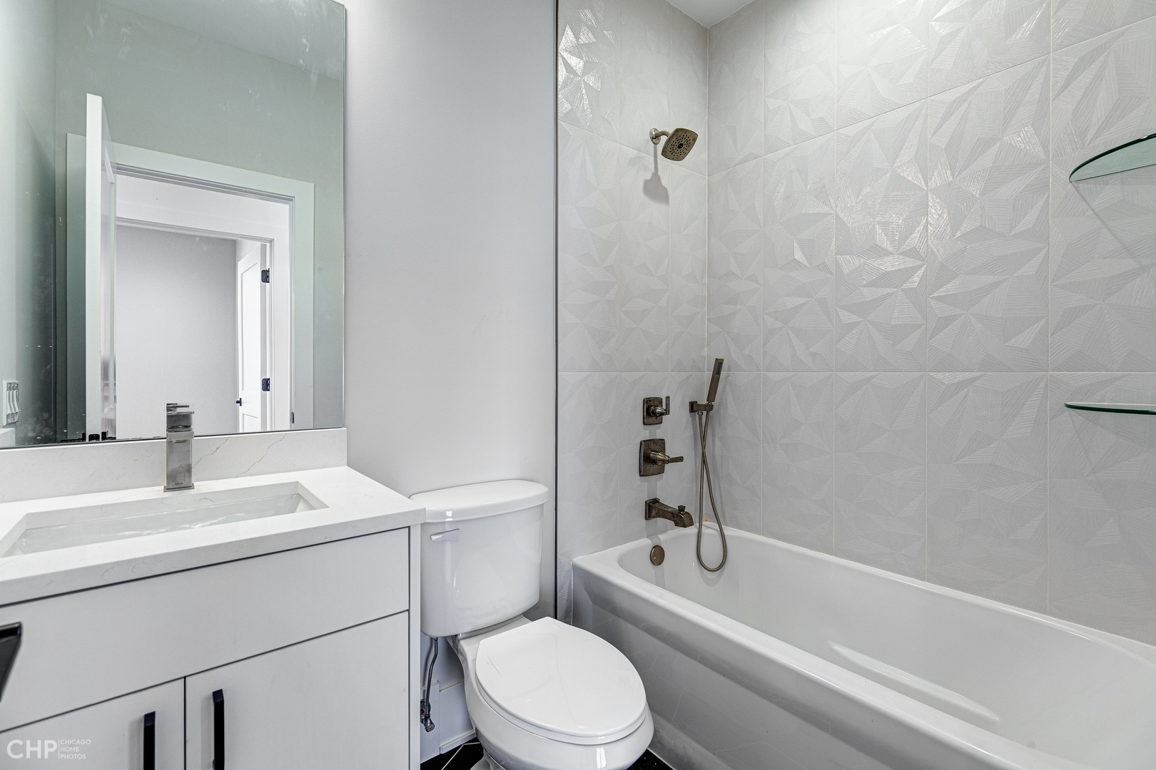 3711 North Spaulding Avenue Chicago, IL 60618 - Photo 25 of 35 a bathroom with a sink toilet and shower