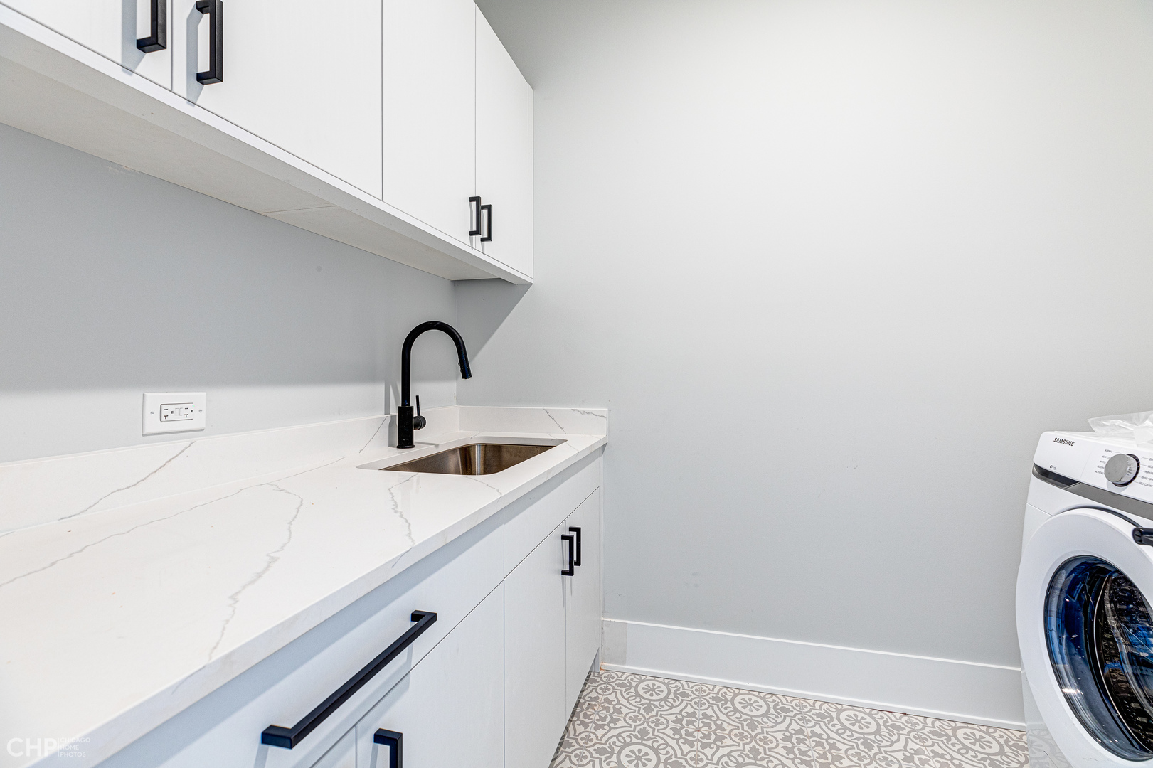 3711 North Spaulding Avenue Chicago, IL 60618 - Photo 27 of 35 a close view of a sink a washer and dryer