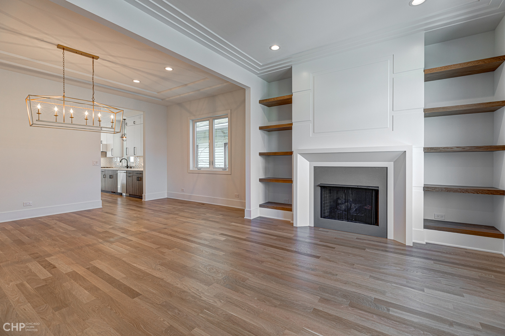 3711 North Spaulding Avenue Chicago, IL 60618 - Photo 3 of 35 a view of an empty room with a fireplace and window