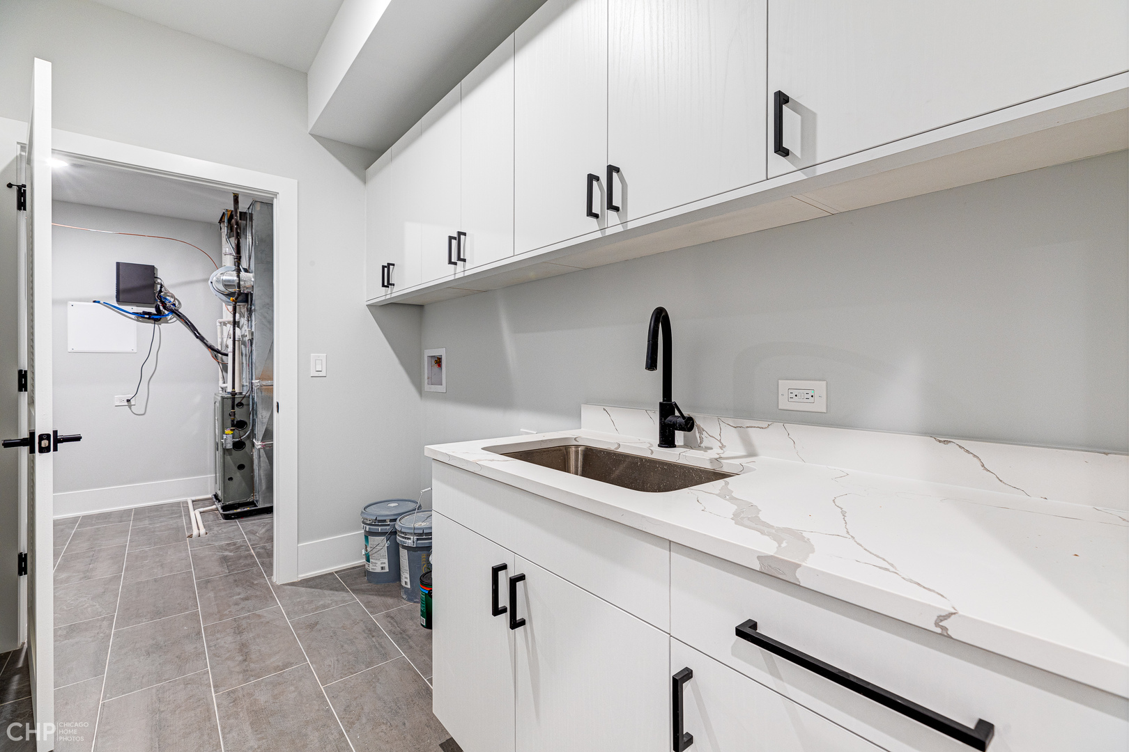 3711 North Spaulding Avenue Chicago, IL 60618 - Photo 32 of 35 a kitchen with a sink and cabinets