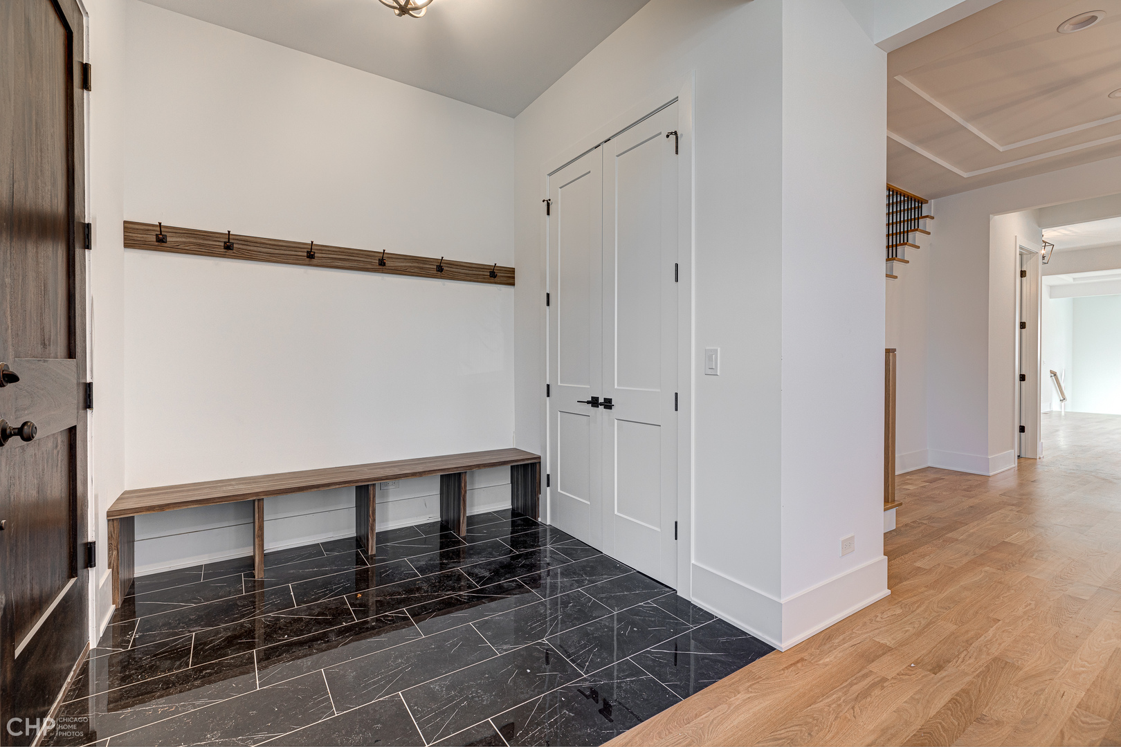 3711 North Spaulding Avenue Chicago, IL 60618 - Photo 4 of 35 a view of a hallway with wooden floor and entryway