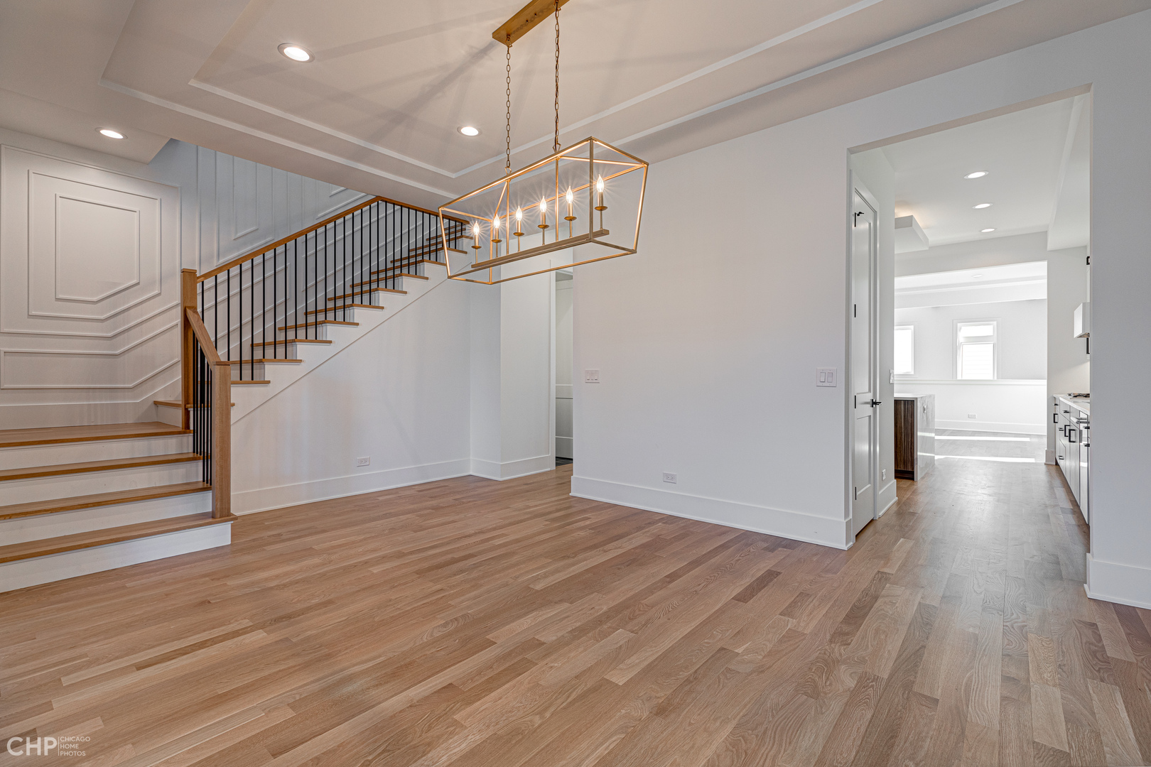 3711 North Spaulding Avenue Chicago, IL 60618 - Photo 5 of 35 a view of a hallway with wooden floor and staircase