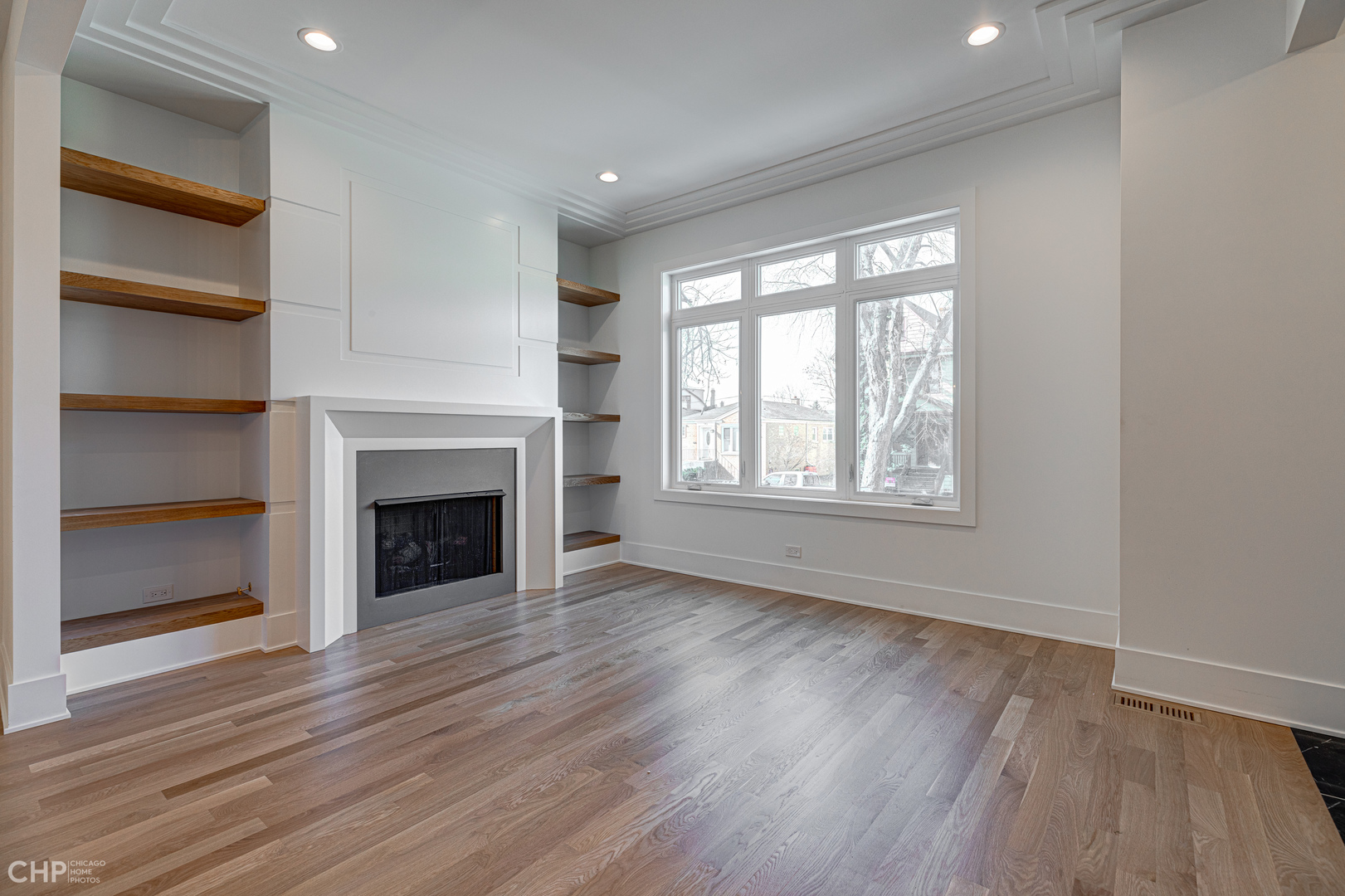 3711 North Spaulding Avenue Chicago, IL 60618 - Photo 6 of 35 a view of an empty room with a window and fireplace