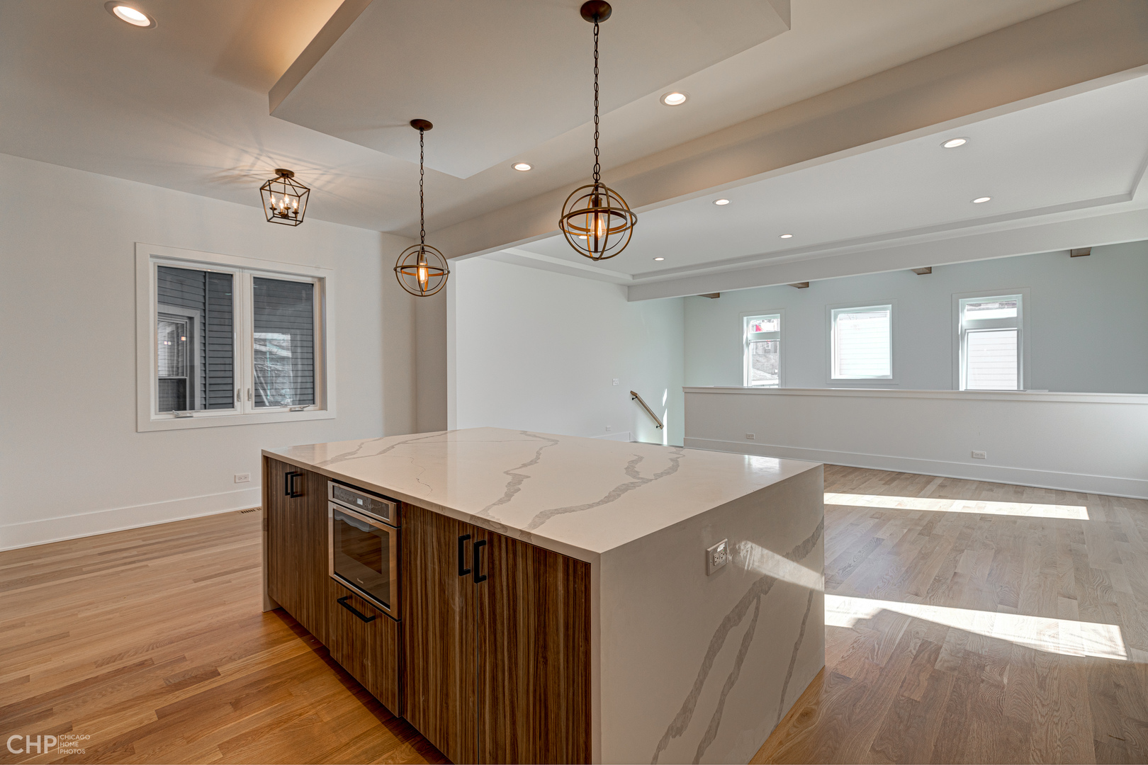 3711 North Spaulding Avenue Chicago, IL 60618 - Photo 10 of 35 a kitchen with a sink a chandelier stainless steel appliances and cabinets