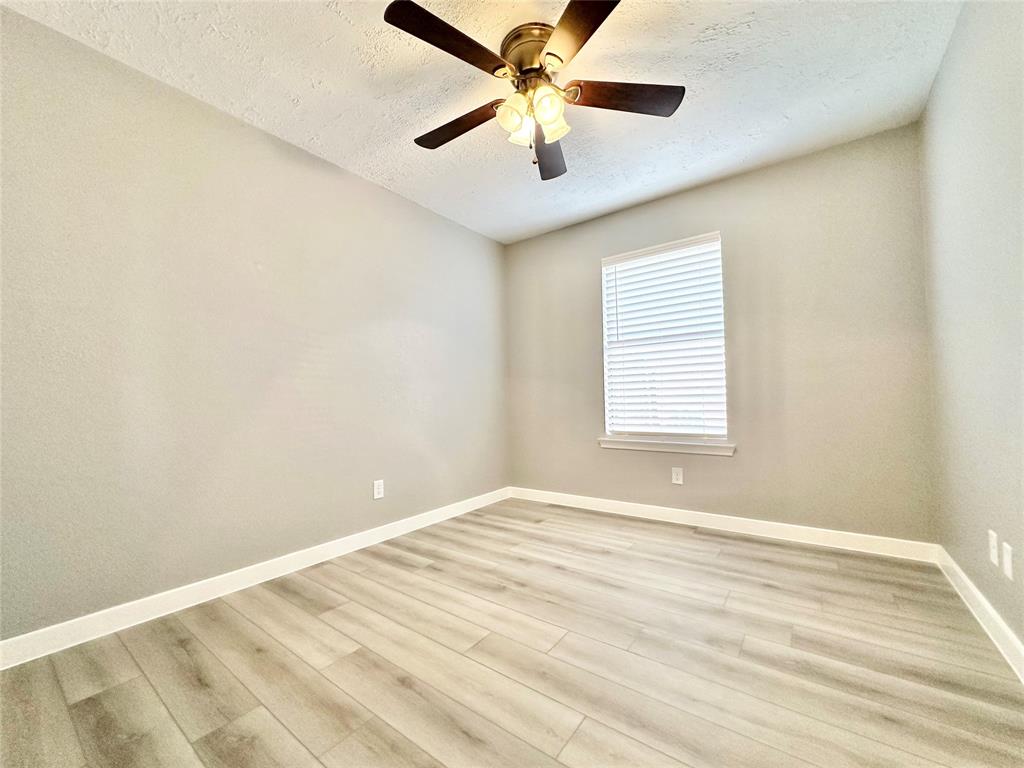 1002 Bull Run Street Denton, TX 76209 - Photo 15 of 21 a view of an empty room with a window