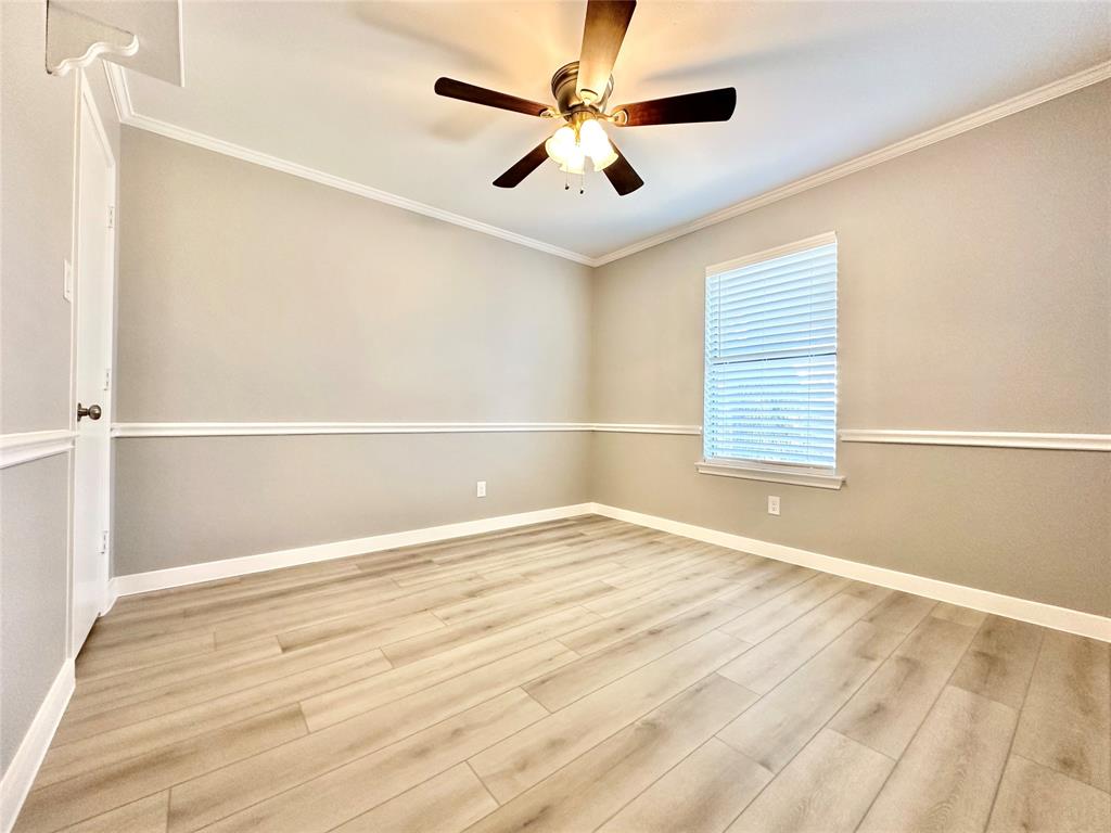 1002 Bull Run Street Denton, TX 76209 - Photo 18 of 21 a view of an empty room with a window
