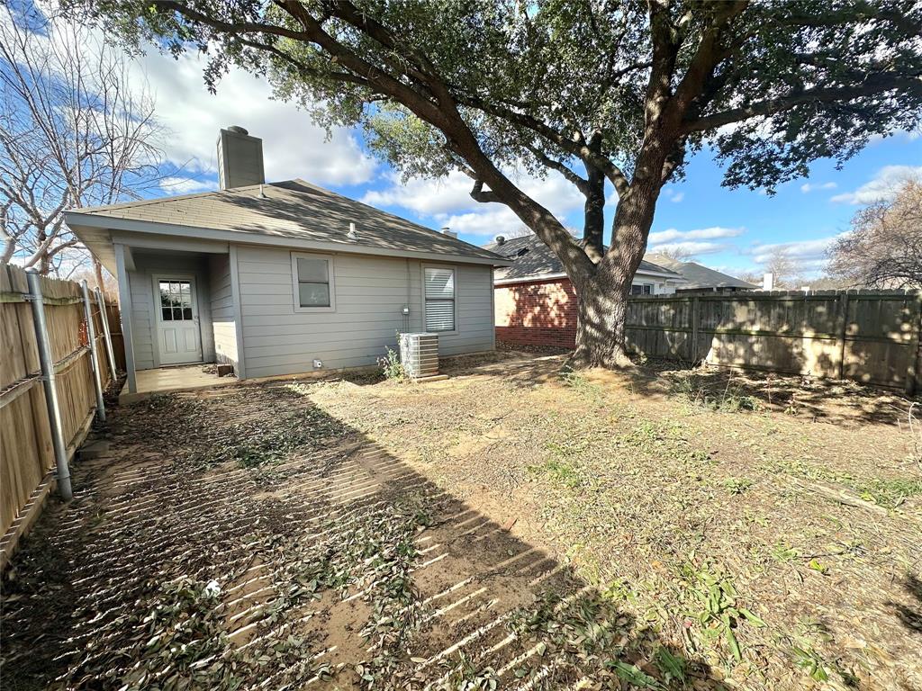 1002 Bull Run Street Denton, TX 76209 - Photo 20 of 21 a front view of a house with a yard