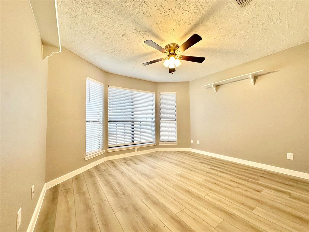 1002 Bull Run Street Denton, TX 76209 - Photo 6 of 21 a view of an empty room with a window