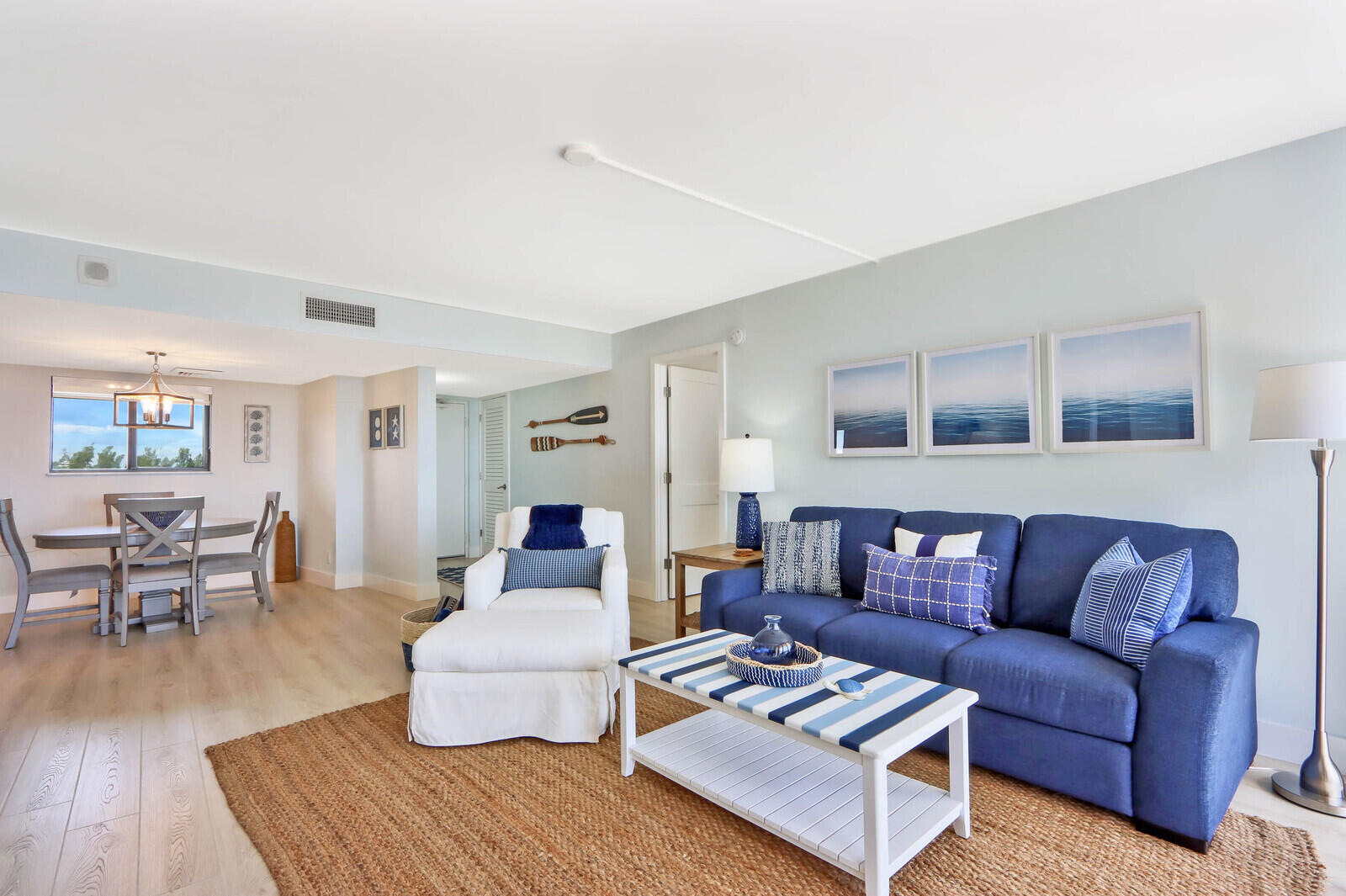 200 Ocean Trail Way, Unit 305 Jupiter, FL 33477 - Photo 3 of 27 a living room with furniture and wooden floor