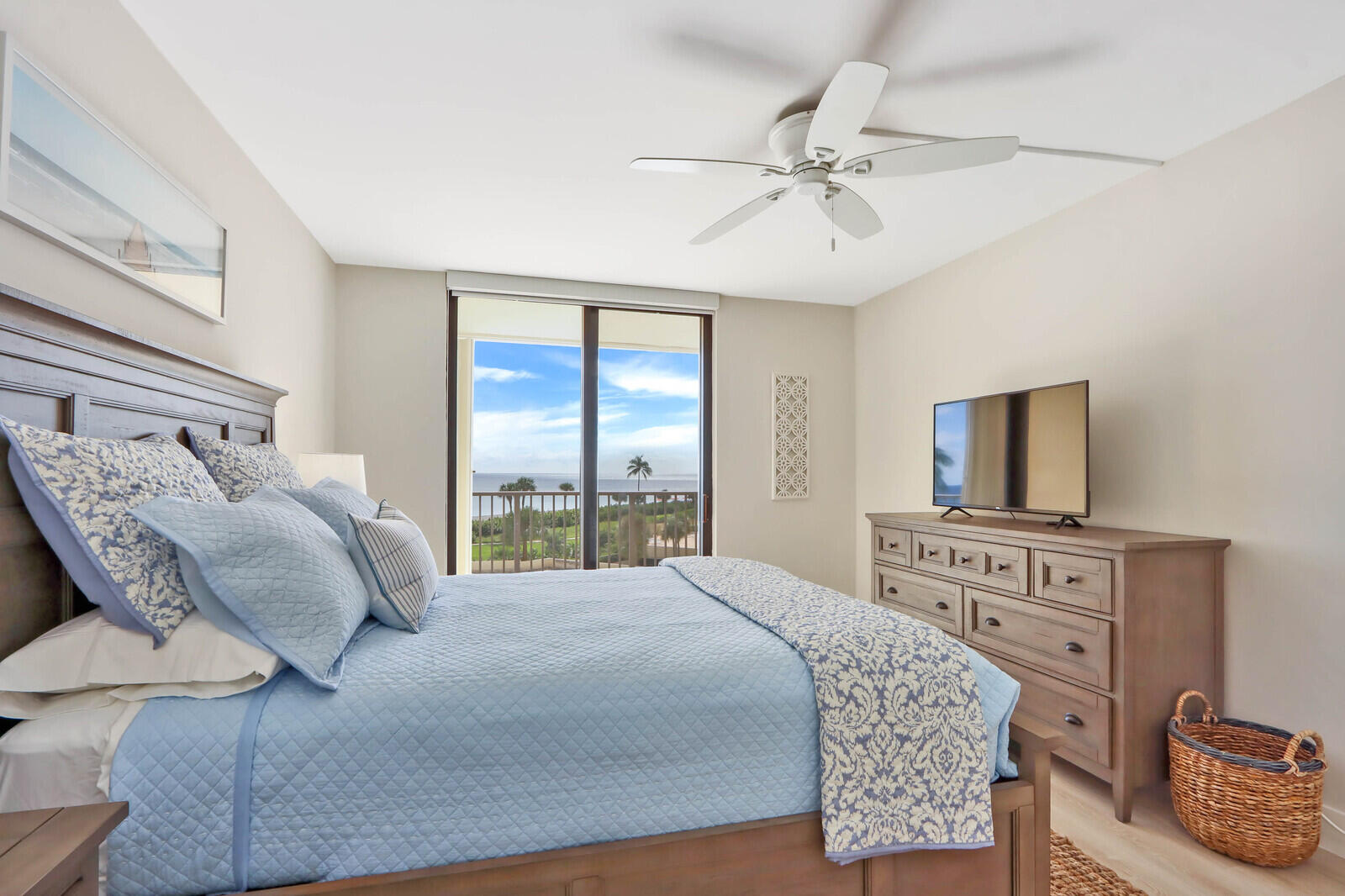 200 Ocean Trail Way, Unit 305 Jupiter, FL 33477 - Photo 9 of 27 a bedroom with a large bed and a window
