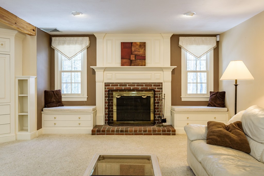 266 Sargent Road Boxborough, MA 01719 - Photo 3 of 15 a living room with furniture and a fireplace