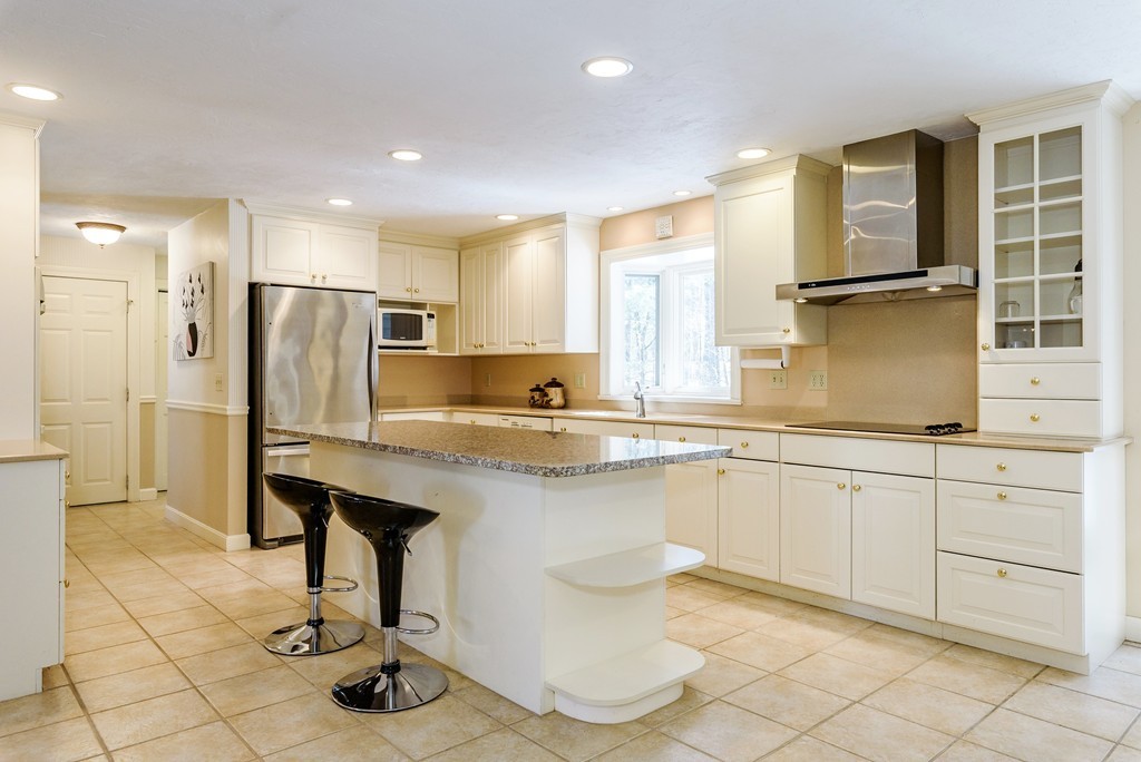 266 Sargent Road Boxborough, MA 01719 - Photo 6 of 15 a kitchen with stainless steel appliances granite countertop a sink and a refrigerator