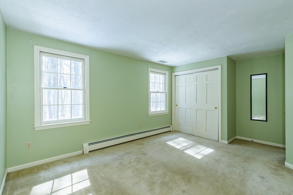 266 Sargent Road Boxborough, MA 01719 - Photo 9 of 15 an empty room with windows