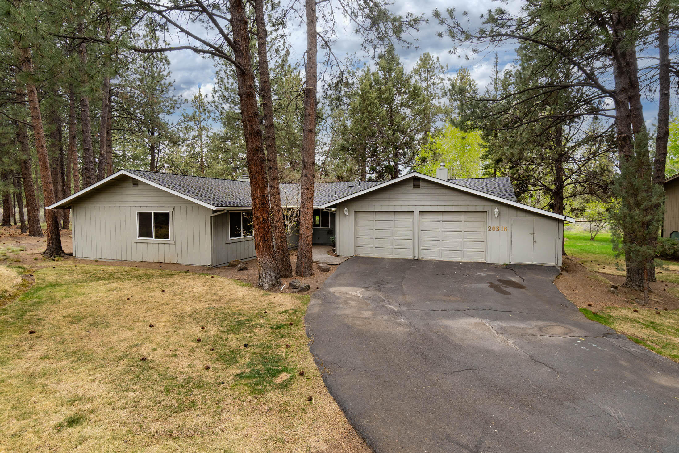 20316 Donkey Sled Road Bend, OR 97702 - Photo 1 of 50 a wooden house with trees in the background