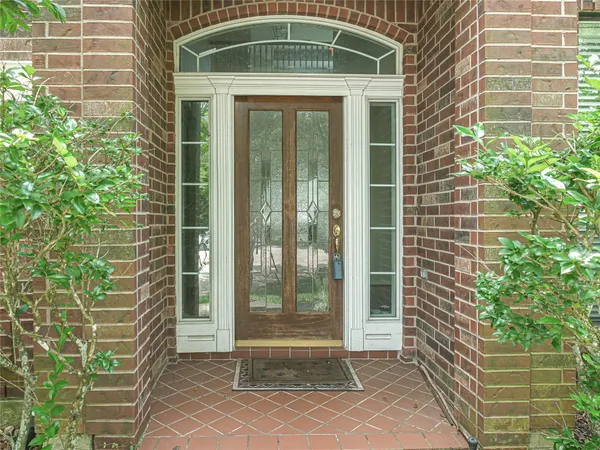 a view of a brick house with a large window