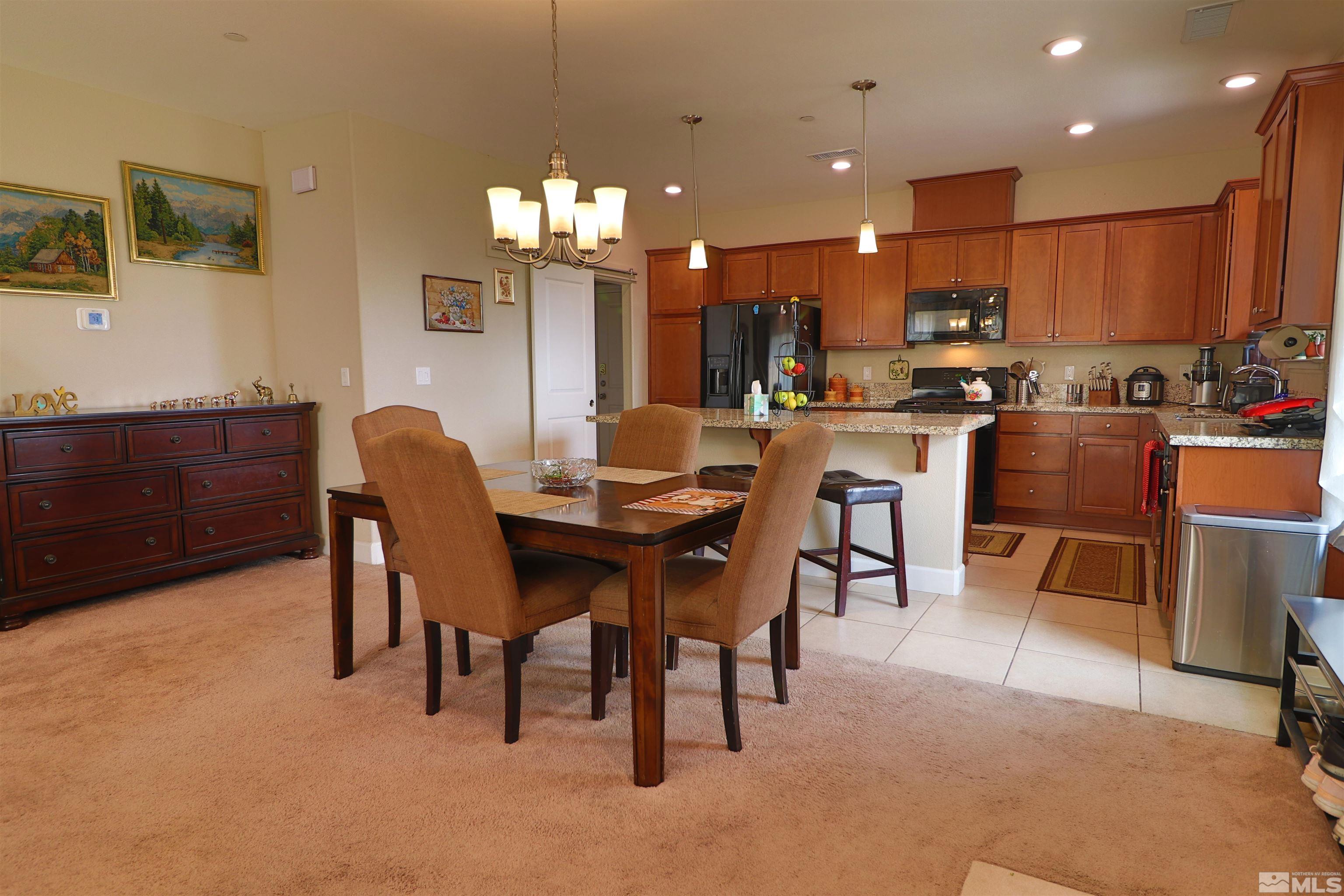 2037 Wind Ranch Road, Unit B Reno, NV 89521 - Photo 4 of 21 a view of a dining room with furniture