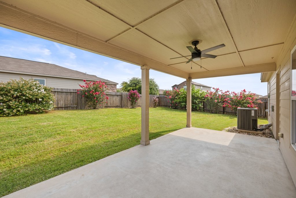 217 Farmer Lane Jarrell, TX 76537 - Photo 25 of 29 Enjoy outdoor living with this large covered patio, perfect for relaxing and entertaining in your private yard.