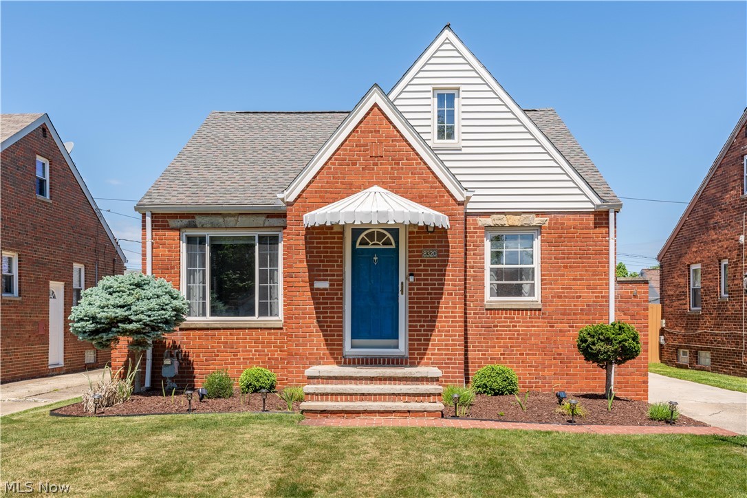 View of front of property with a front lawn