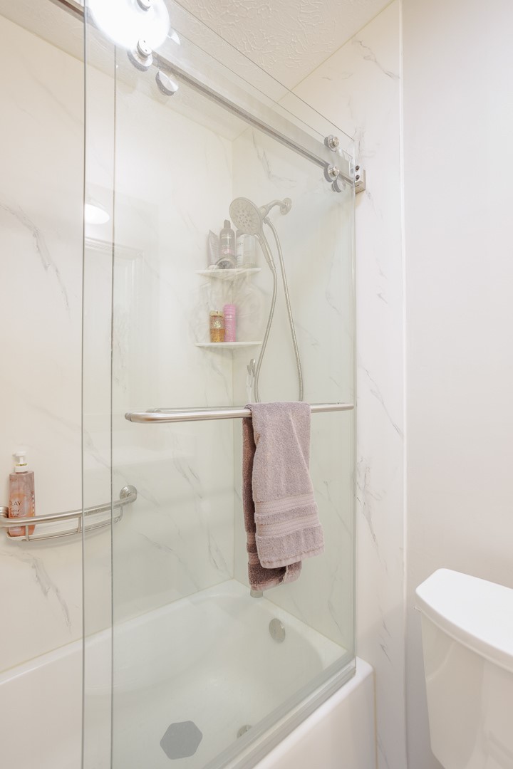 540 Basil Street Springboro, OH 45066 - Photo 22 of 32 This clean and bright bathroom features a modern shower-tub combination, providing comfort and style.