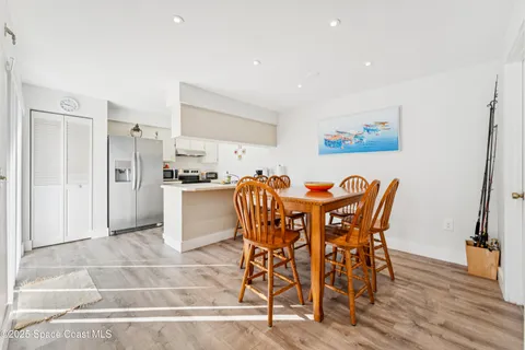 a kitchen with stainless steel appliances granite countertop a stove and a refrigerator