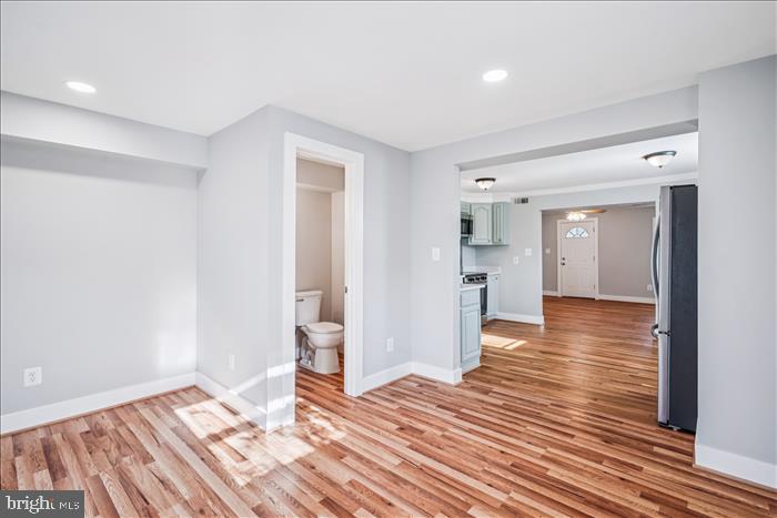 501-503 8th Street Laurel, MD 20707 - Photo 13 of 86 a view of a room with wooden floor and a kitchen