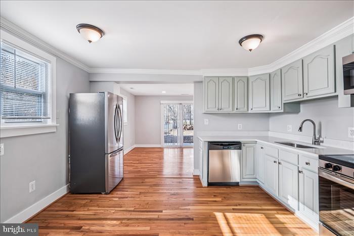 501-503 8th Street Laurel, MD 20707 - Photo 16 of 86 a kitchen with stainless steel appliances granite countertop a refrigerator sink and cabinets