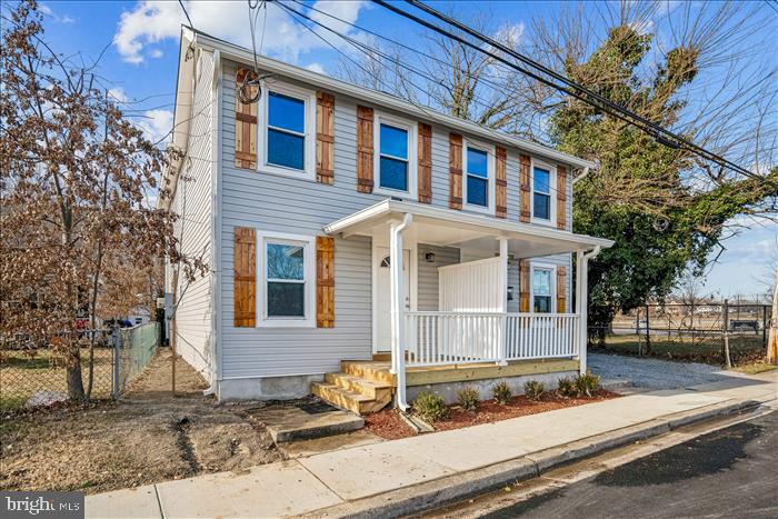 501-503 8th Street Laurel, MD 20707 - Photo 2 of 86 a front view of a house with garden