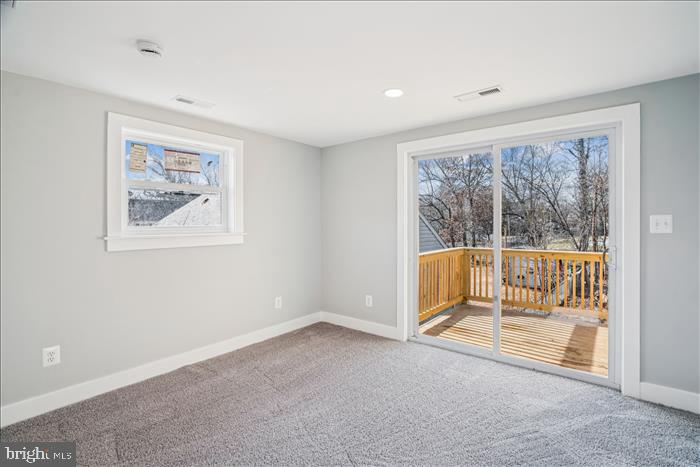 501-503 8th Street Laurel, MD 20707 - Photo 26 of 86 an empty room with wooden floor and windows