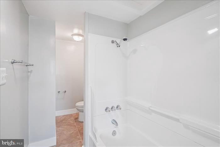 501-503 8th Street Laurel, MD 20707 - Photo 28 of 86 a bathroom with a bathtub and a shower