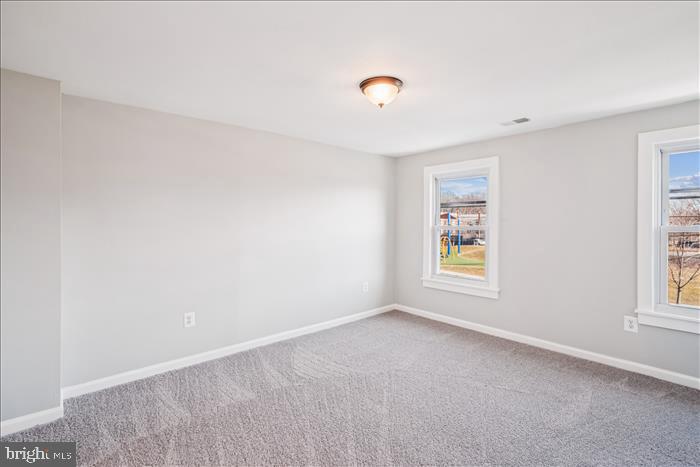 501-503 8th Street Laurel, MD 20707 - Photo 30 of 86 an empty room with windows