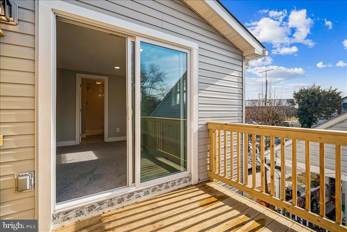 501-503 8th Street Laurel, MD 20707 - Photo 35 of 86 a view of a balcony with a potted plants