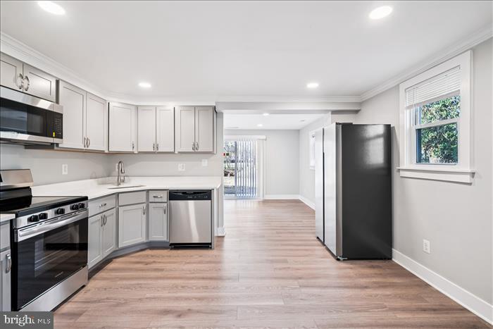 501-503 8th Street Laurel, MD 20707 - Photo 54 of 86 a kitchen with stainless steel appliances granite countertop a refrigerator stove top oven and sink