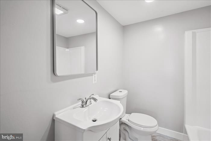 501-503 8th Street Laurel, MD 20707 - Photo 68 of 86 a bathroom with a sink toilet and mirror