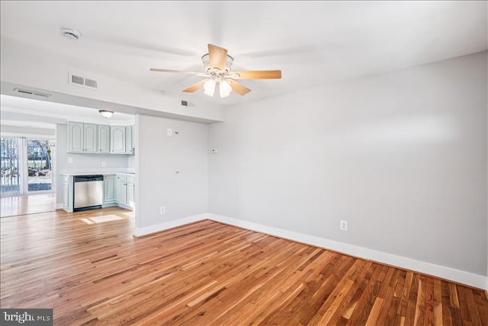 501-503 8th Street Laurel, MD 20707 - Photo 10 of 86 a view of empty room with wooden floor and fireplace