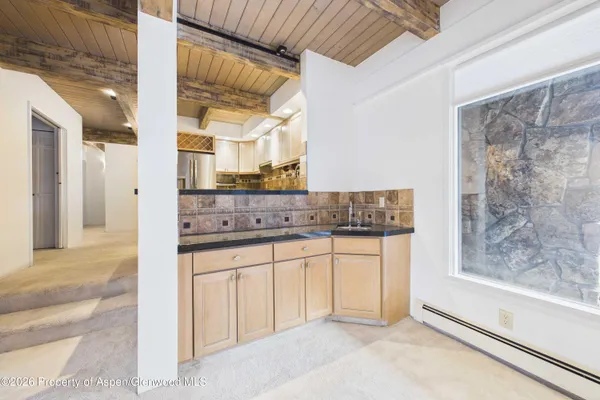 a view of a bathroom with sink and mirror