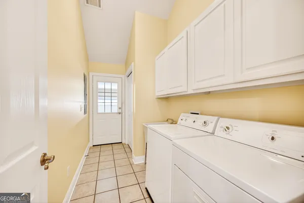 a utility room with dryer and washer