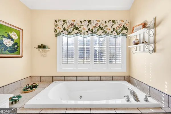 a bathroom with a bathtub and shower