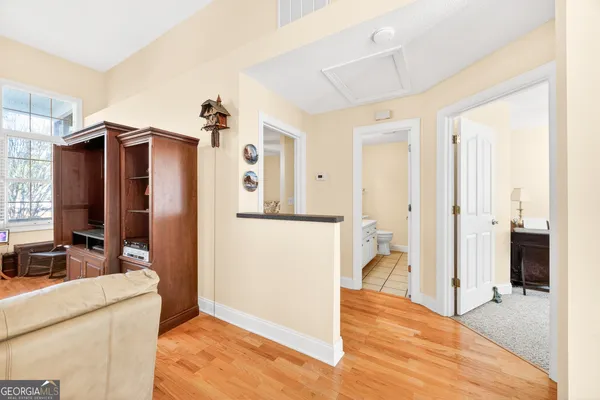 a view of a kitchen cabinets and a wooden floor