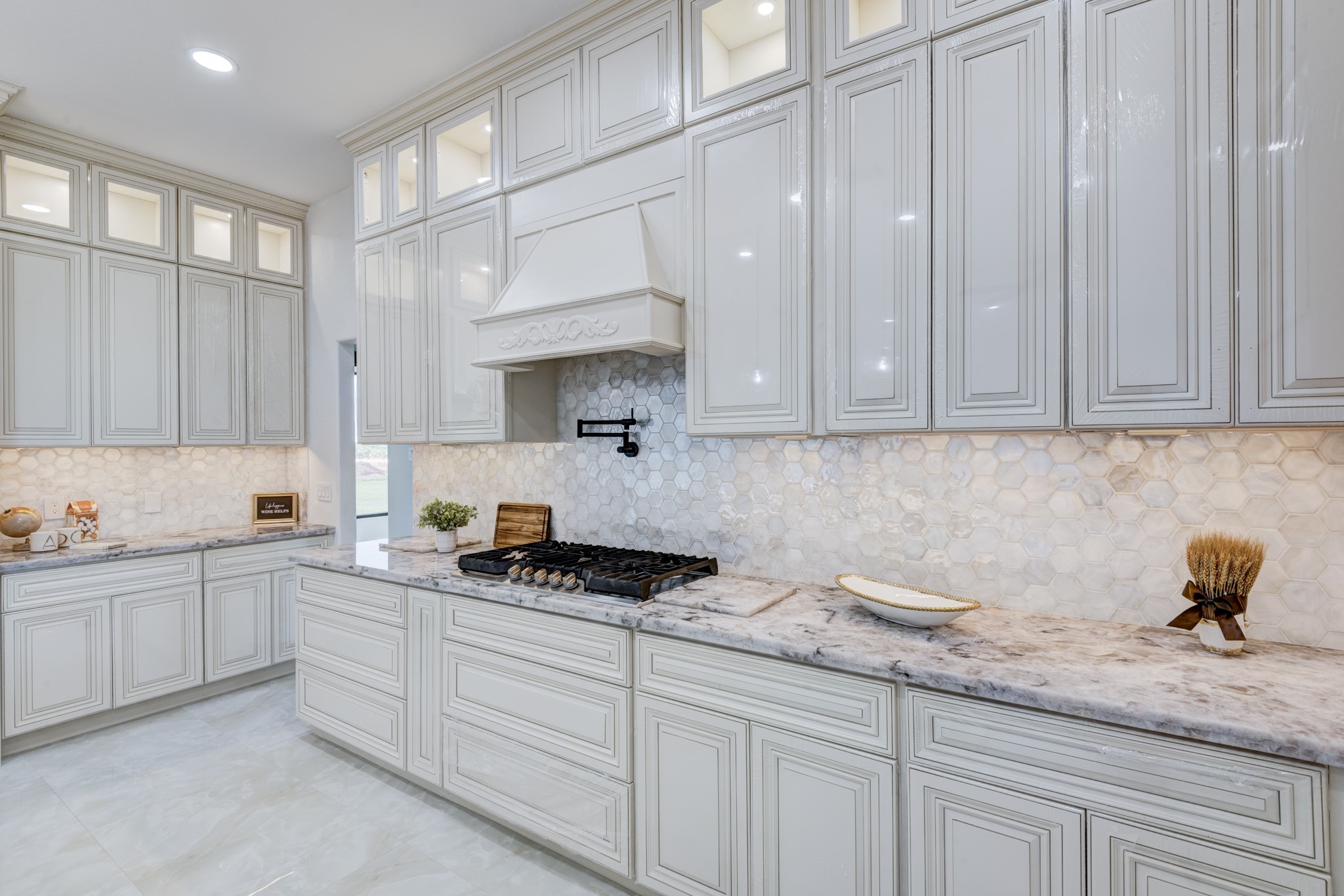 7348 Love Road Fulshear, TX 77441 - Photo 10 of 48 stylish hexagonal tile backsplash, and ample cabinetry for storage.