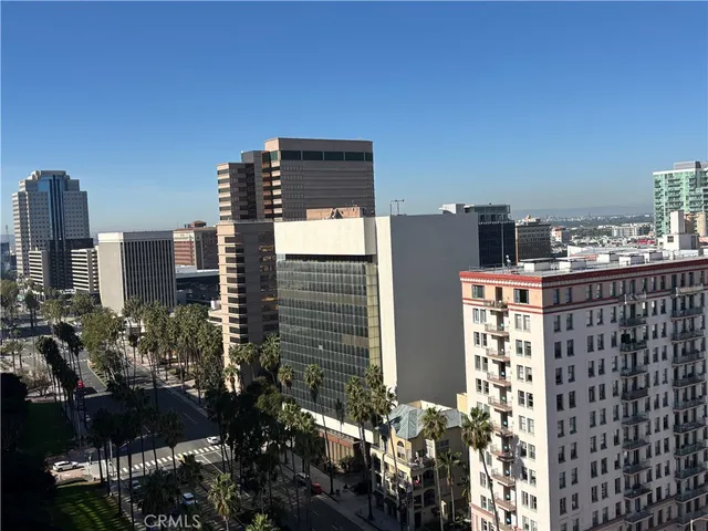 a kitchen with a sink a microwave and cabinets