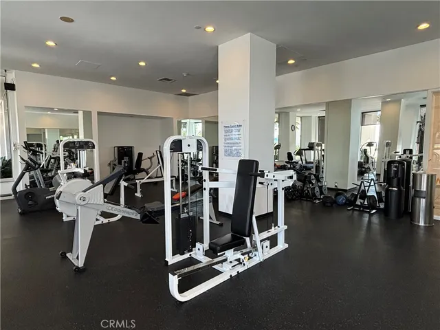 a lobby with furniture and a potted plant
