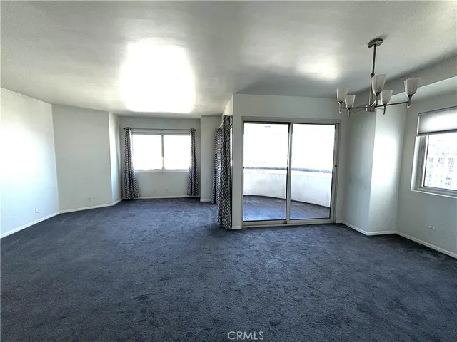 an empty room with large window
