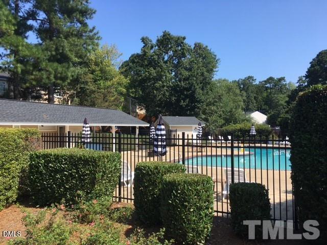 7708 Crown Crest Court Raleigh, NC 27615 - Photo 25 of 27 a view of a chairs and table in the backyard