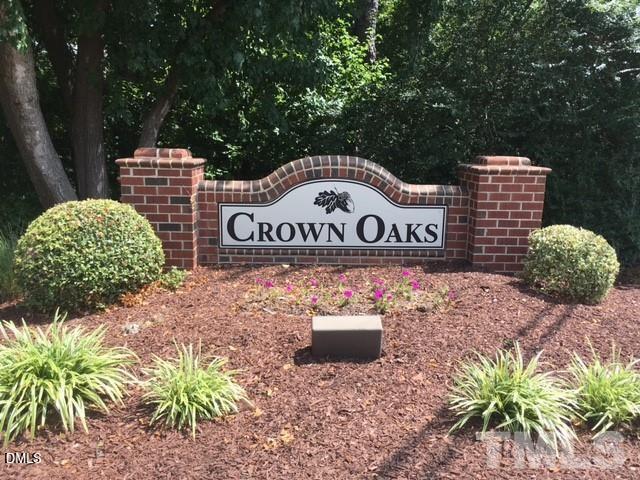 7708 Crown Crest Court Raleigh, NC 27615 - Photo 3 of 27 a sign that is on a brick wall