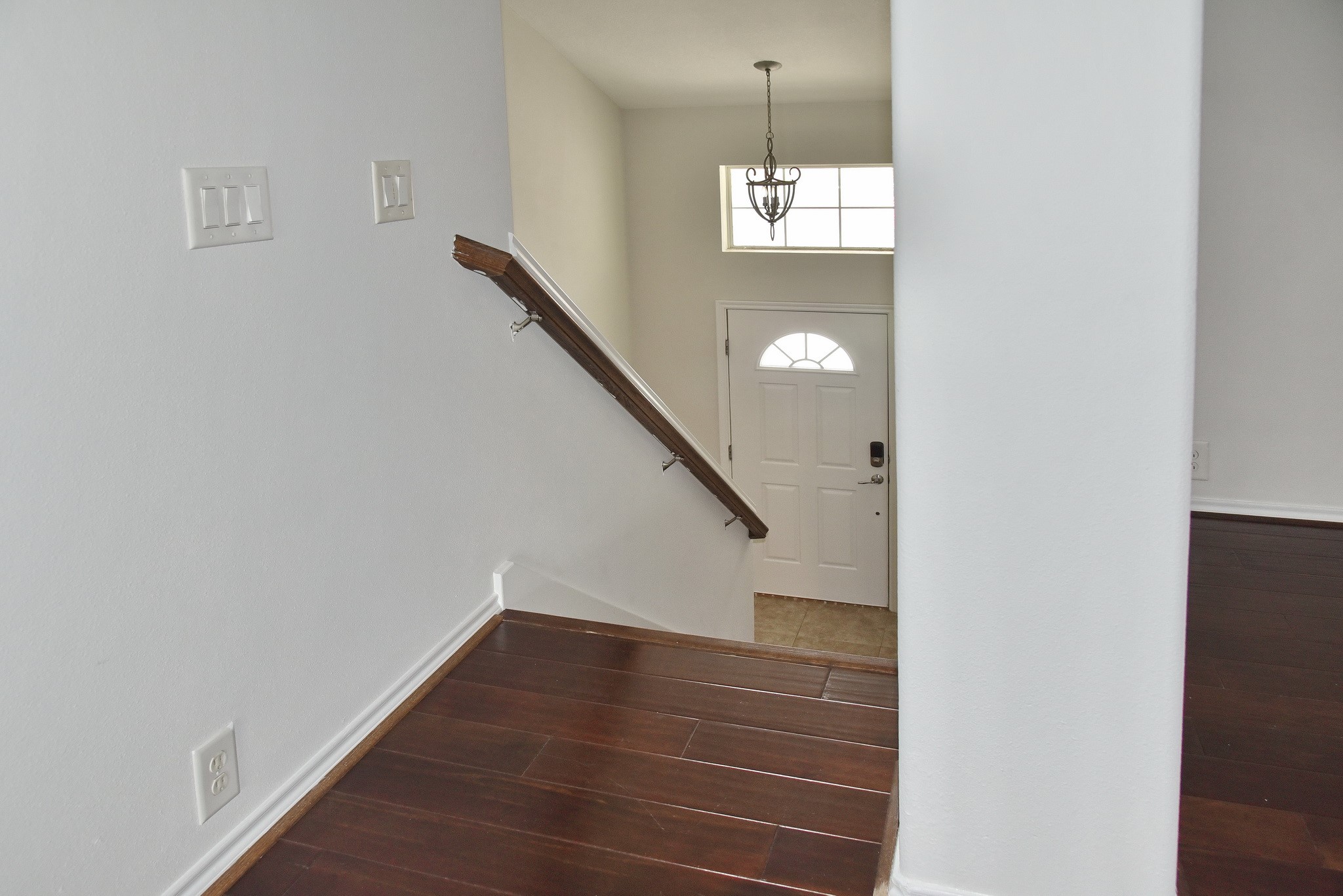 13600 Breton Ridge Street, Unit 20B Houston, TX 77070 - Photo 6 of 32 a view of entryway and hall with wooden floor