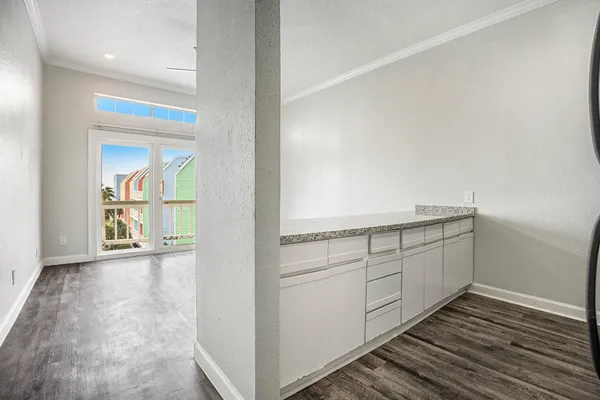 a view of a kitchen with an empty space and a sink