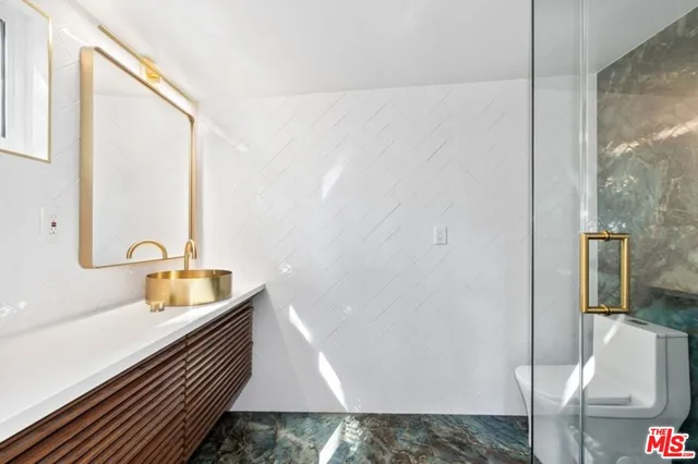 a bathroom with a sink and shower