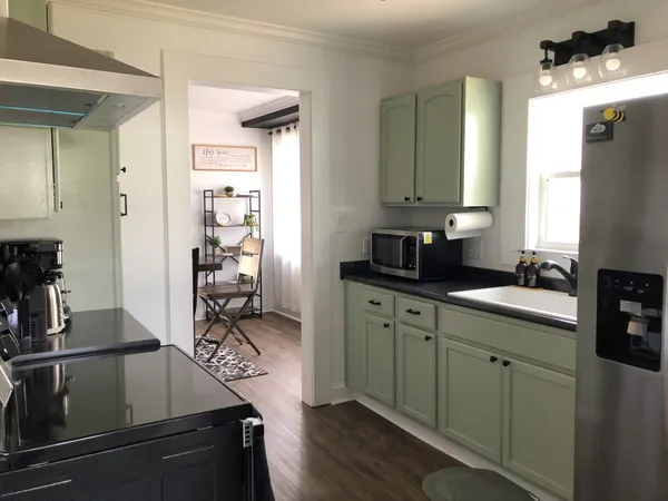 a kitchen with a sink and cabinets